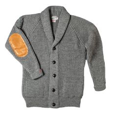 A versatile chunky knit, this Classic, shawl neck cardigan gives a relaxed look to your style, with a new twist… we’ve added Italian Tan Calfskin leather elbow patches with double stitching. The Cardigan features a ribbed collar, cuff, and hem, as well as the classic 5 leather buttons on the front. This is comfort, warmth, and style in one garment. Designed and made in Britain - Produced for &SONS by a family business that blend traditional talents with 21st-century wool for versatile heritage. Leather Elbow Patches, Surf Vintage, Selvedge Denim Jeans, Shawl Neck, Work Wear Outfits, Denim Workwear, Elbow Patch, Collar Cardigan, Mens Lifestyle