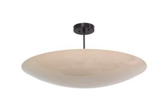 a large white bowl light hanging from a ceiling fixture with a black metal rod and round glass shade