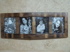 a wooden frame with four photos hanging on it's side in front of a wall