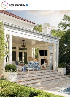 an outdoor living area with blue and white furniture