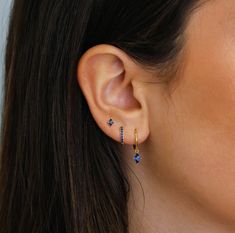 ✦ 𝐈𝐭𝐞𝐦 𝐃𝐞𝐬𝐜𝐫𝐢𝐩𝐭𝐢𝐨𝐧 "Discover elegance with our Sapphire Earring Set by Pashicreations. Featuring Dangling Earrings, Hoop Earrings, and Stud Earrings, each piece is crafted to elevate any occasion. Ideal as Blue Birthstone Jewelry and an Anniversary or Birthday Gift, our collection offers timeless sophistication for everyday wear. Explore minimalist jewelry, perfect for her." ✦ Product Details:- Material: Sterling Silver Finish: 14k Gold Plated Featuring a Set of 3 CZ Sapphire Earr Set Of 3 Earrings, Gold And Sapphire Earrings, Blue Earring Stack, Minimalist Ear Piercings, Sapphire Earring, Blue Sapphire Earrings, Sapphire Earrings Studs, Sapphire Studs, Dangle Hoop Earrings