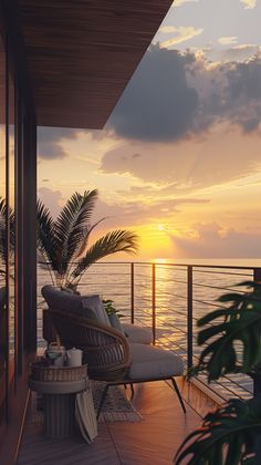 the sun is setting over the ocean from a deck with wicker furniture and palm trees