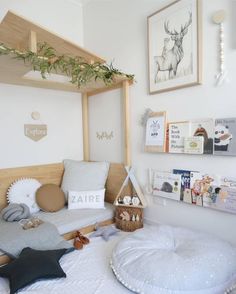 a child's bedroom with bunk beds and pictures on the wall