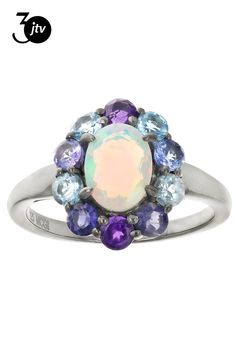 0.60ctw White Ethiopian Opal with 0.23ctw Glacier Topaz���, 0.23ctw Swiss Blue Topaz, 0.15ctw Iolite, 0.18ctw Amethyst, 0.18ctw Tanzanite, Black Rhodium Over Sterling Silver Ring. Measures Approximately 0.46"L x 0.54"W. Not Sizeable. School Jewelry, Popular Jewelry, Swiss Blue Topaz, Black Rhodium, Turquoise Jewelry, Ethiopian Opal, Jewelry Making Beads, Online Jewelry, Sterling Silver Ring