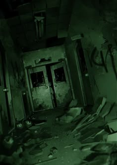 an abandoned room with broken doors and debris on the floor