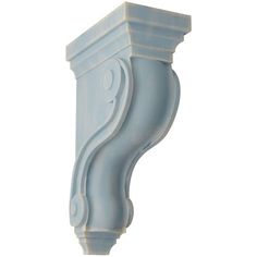 the corner of a wall bracket is painted light blue with swirls and scrolls on it