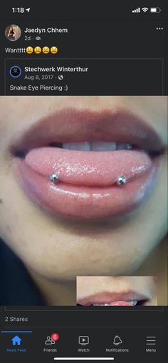 a woman's lips are shown with piercings on the bottom and bottom lip