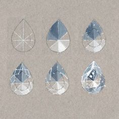 an image of different shapes and sizes of water droplet stones on paper with blue ink