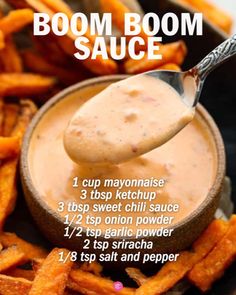 a spoon full of dipping sauce on top of sweet potato fries