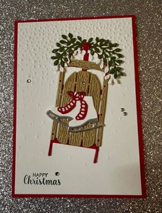 a handmade christmas card with an image of a rocking chair