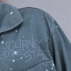 a blue jacket with the words journey to the star written on it