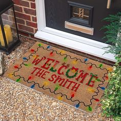 a welcome mat with the words welcome to the smith on it in front of a door