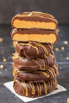 a stack of chocolate covered donuts sitting on top of each other