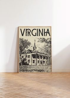 an old poster with the name virginia on it in front of a white wall and wooden floor