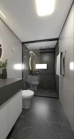 a bathroom with a toilet, sink and mirror in the corner next to a shower stall