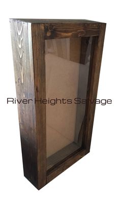 a wooden box with glass doors on the inside