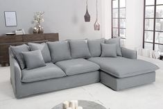 a large gray sectional couch in a living room