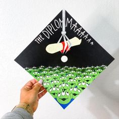 someone is holding up a graduation cap that says, the difflon mamma