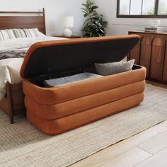 an inflatable bed sitting on top of a wooden floor next to a dresser