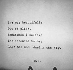 someone is sitting on the ground with their feet up and there is a quote above them that says, she was beautifully out of place sometimes i believe