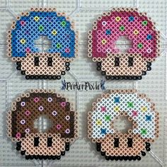 three donuts made out of perler beads on a white tile background with the words perler pixel