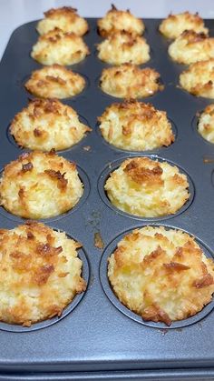 a muffin tin filled with lots of food sitting on top of a stovetop