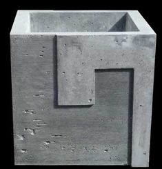 a concrete block with two square holes in it