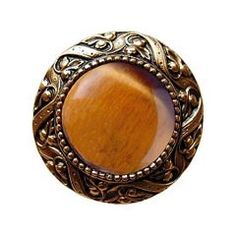 Solid Pewter Cabinet/Drawer Knob This 24k gold plate finish cabinet knob with victorian jewel design and tiger eye natural stone center is a perfect blend of craftmanship in traditional and contemporary design to complement any decor. Mounting hardware included. PLEASE NOTE: Due the handmade nature of this item, a 1-3 week lead time may be required before shipment for larger orders. Most items ship within 3-5 days. We will clearly communicate any lead time requirements upon order processing or y Eye Natural, Brass Cabinet Knob, Decorative Knobs, Blue Sodalite, Antique Pewter, Notting Hill, Cabinet Knob, Decorative Hardware, Knobs And Handles