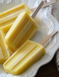 several pieces of yellow candy on a white plate