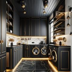 a black kitchen with gold accents and marble flooring is pictured in this image, there are lights on either side of the washer and dryer