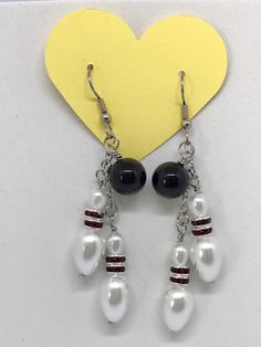 Bowling theme hook earrings with black onyx gloss stone | Etsy Beads For Earring Making, Holiday Earring Ideas, White Dangle Jewelry With Black Beads, Funky Earrings Diy, Bead Earrings Ideas, Halloween Earrings Diy, Glass Bead Jewelry Diy, Simple Bead Earrings, Diy Jewelry Ideas