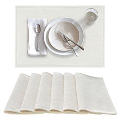 a place setting with napkins and silverware