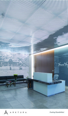 an office lobby with modern furniture and large screen wall art above the reception desks