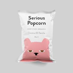 a bag of serious popcorn sitting on top of a gray surface with the words, certified organic coconut & vanilla