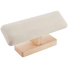 a wooden stand with a cushion on it