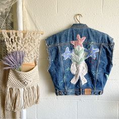 Such A Lovely, Unique And One Of A Kind Piece Of Art Which Is Timeless. A Classic Denim Vest With Large Embroidery On The Back And Paint Splatter Detailing Throughout And Distressed Sleeve Cuffs. Condition: New (With Tag) Color: Denim Contents: 100% Cotton Care: Machine Wash Cold Measurements: Pit To Pit: 24” Length: 25” From Free People: Please Note: Due To The Handmade Nature Of This Style, Each Piece Is Unique And May Vary From The Photo. Reworked From Handpicked Textiles, This Effortlessly E Blue Relaxed Fit Denim Vest For Spring, Relaxed Fit Blue Denim Vest For Spring, Spring Medium Wash Recycled Denim Vest, Spring Denim Vest With Pockets In Recycled Material, Spring Patchwork Denim Vest In Blue, Spring Denim Blue Recycled Denim Outerwear, Spring Denim Blue Recycled Denim Vest, Blue Recycled Denim Vest With Pockets, Blue Denim Vest With Pockets In Recycled Material