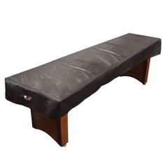 a black bench cover on top of a wooden frame with an attached foot rest area