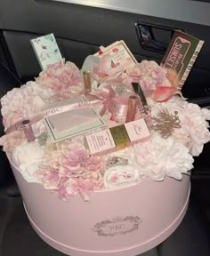 a pink box filled with lots of different items