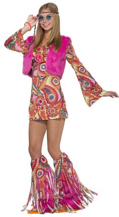 a woman in a colorful costume is talking on her cell phone while posing for the camera