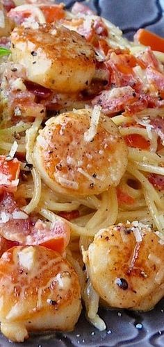 some shrimp and pasta on a blue plate