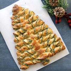 a pastry on a cutting board next to a christmas tree decoration