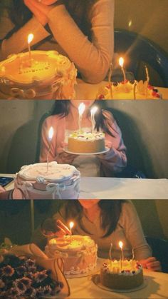 two women sitting at a table with cakes and candles in front of them, one holding a cake