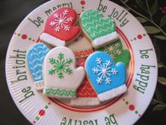 decorated christmas cookies on a paper plate