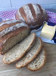 several loaves of bread and butter on a table