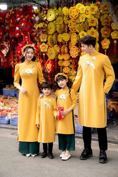 Family matching Traditional Vietnamese Ao Dai. Mom and daughters include ao dai and pants. Dad and boys only have Ao Dai. Very well made with high-quality Velvet fabric. Hand embroidery This set includes the Ao Dai and pants with no headband. It's Asian Size, it may run out 1-2 size smaller than international size.  Please see size chart for measurements of available pre-made sizes. Please provide your chest and waist measurement when placing your order so we can ensure the best fit for you. Ple Spring Long Sleeve Sets For Traditional Ceremonies, Festive Long Sleeve Matching Set Dress, Festive Long Sleeve Dresses Matching Set, Embroidered Long Sleeve Ao Dai For Festive Occasions, Traditional Long Sleeve Kurta Matching Set, Ceremonial Embroidered Ao Dai With Long Sleeves, Traditional Yellow Ao Dai, Festive Long Sleeve Embroidered Cheongsam, Spring Festive Embroidered Ao Dai