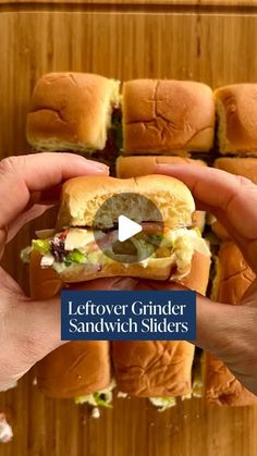 someone holding a sandwich in their hand with the words leftover grinder sandwiches on it