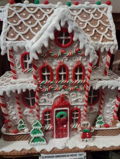 a large gingerbread house decorated with candy canes