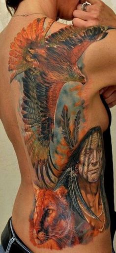 a woman with an eagle tattoo on her back and chest is posing for the camera