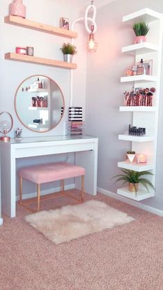 a white desk with a mirror, shelfs and plants on it in a room