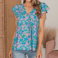 So Feminine And Flirty- We Are Loving This! The For A Moment Women’s Boutique Printed Babydoll Top Features A Deep V-Neckline, Flutter Sleeves, Empire Waist, And A Flared Bottom Hem. The Multicolored Floral Print Has The Perfect Mix Of Blues, Pinks, And Greens! Fit Details: Fitted In The Bust With No Stretch. V-Neckline With Empire Waist Ruffle Cap Sleeves Size Medium Medium: Bust 36“ Length 24“ New Women’s Boutique Clothing Brand: Emily Wonder Retail Price: $48-$52 Fast Shipping! Bundle & Save! Feminine Blue Top With Flutter Sleeves, Feminine Blue Flutter Sleeve Top, Light Blue Floral Print V-neck Top, Cute Light Blue V-neck Top, Blue Floral Print Top With Flutter Sleeves, Blue Ruffle Sleeve Tops For Vacation, Blue Feminine Top With Ruffle Sleeves, Blue Flutter Sleeve Tops With Floral Print, Blue Floral Print Tops With Flutter Sleeves